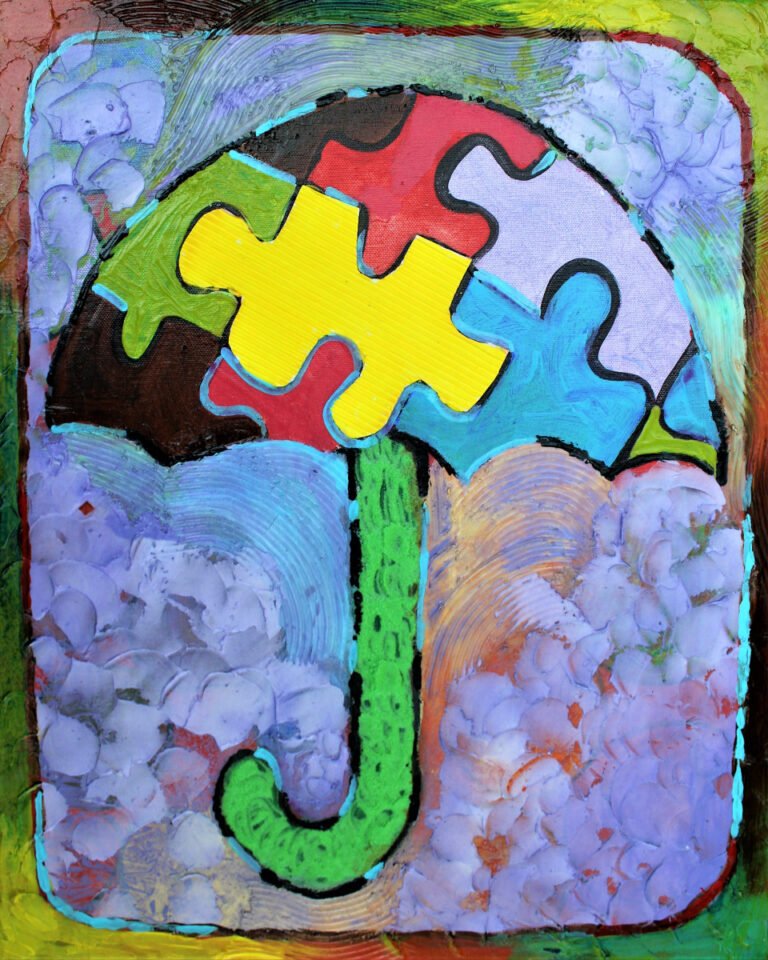 An artistic representation of a sensor-friendly symbol. The umbrella is composed of jigsaw puzzle pieces in various colors, which is a motif often linked to autism awareness and the diversity of the autism spectrum. The jigsaw pieces form the canopy of the umbrella in vibrant colors like red, green, blue, and yellow, symbolizing a sheltering presence that embraces different sensory needs. The handle of the umbrella is depicted in a lush green, curving gently at the bottom. The background features a mix of cool blues and purples with a textured appearance, giving the impression of a calm and accommodating space. The umbrella is encased within a thick, multi-hued border, emphasizing the concept of a safe and inclusive environment for those with sensory sensitivities.