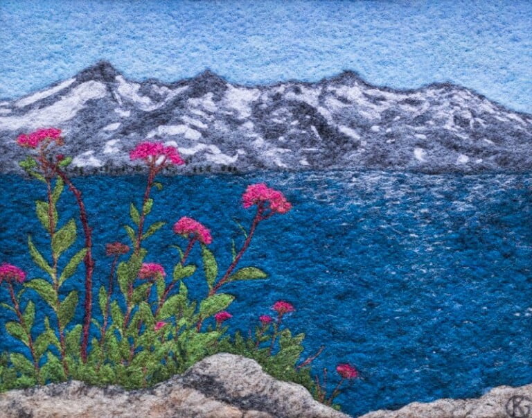 Textured artwork of mountain, lake, and pink flowers.