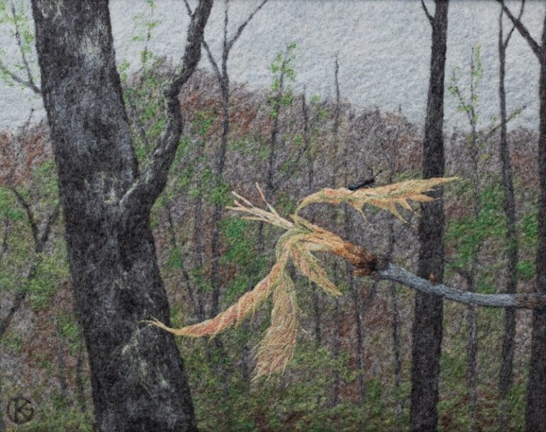 Forest embroidery art with detailed trees and leaves.